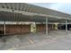 Covered parking area with designated parking spots, providing convenient and protected parking for residents at 4262 E Maplewood Way, Centennial, CO 80121