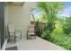 Relaxing outdoor patio with two chairs and view of mature trees at 4262 E Maplewood Way, Centennial, CO 80121