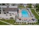 Aerial view of a sparkling community pool with lounge chairs, perfect for relaxation and enjoying the outdoors at 4262 E Maplewood Way, Centennial, CO 80121
