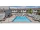 Inviting community pool surrounded by lounge chairs, offering a perfect spot for relaxation and socializing at 4262 E Maplewood Way, Centennial, CO 80121