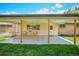 Charming outdoor space featuring a covered patio with seating, perfect for relaxing and entertaining at 6987 E Wyoming Pl, Denver, CO 80224