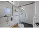Sleek bathroom featuring a glass shower, modern fixtures, and white subway tile at 6987 E Wyoming Pl, Denver, CO 80224