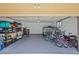 Spacious garage with ample storage, shelving, and room for multiple bicycles and a trailer, ideal for hobbyists at 6987 E Wyoming Pl, Denver, CO 80224