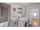 Bright laundry room with a utility sink and washer/dryer, and access to an outside door at 6987 E Wyoming Pl, Denver, CO 80224