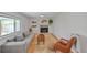 Open living room with modern furniture, a fireplace, and large windows at 6987 E Wyoming Pl, Denver, CO 80224