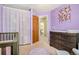 A delightful Bedroom in soft lavender with a coordinating rug, plus easy access to bathroom and closet at 5310 E Manchester Dr, Castle Rock, CO 80104
