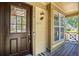 Close-up of a welcoming front door with a decorative welcome sign and sidelight window at 5310 E Manchester Dr, Castle Rock, CO 80104