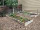 Raised garden beds brimming with vegetables and colorful flowers, enhancing the backyard's appeal at 5310 E Manchester Dr, Castle Rock, CO 80104