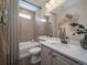 Clean bathroom with a shower and bathtub combo, vanity sink, and modern fixtures at 21935 E 51St Dr, Aurora, CO 80019