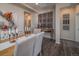 Dining room with wood floors, tufted chairs and modern decor at 21935 E 51St Dr, Aurora, CO 80019