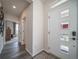 Bright entryway with wood floors and a door featuring decorative window panes at 21935 E 51St Dr, Aurora, CO 80019