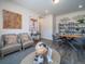 Cozy living room with hardwood floors, modern decor, and plenty of seating space at 21935 E 51St Dr, Aurora, CO 80019