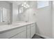 Well-lit bathroom with a double sink vanity, quartz countertop, and large mirrors for a luxurious feel at 453 Interlocken Blvd # 104, Broomfield, CO 80021