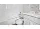Clean bathroom with a combined tub and shower, modern toilet, and white vanity for a sleek look at 453 Interlocken Blvd # 104, Broomfield, CO 80021