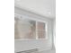 Sun-lit bedroom features large windows and neutral paint at 453 Interlocken Blvd # 104, Broomfield, CO 80021