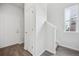 Bright entryway featuring wood floors and a staircase leading upstairs at 453 Interlocken Blvd # 104, Broomfield, CO 80021