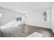 Bright living room features wood floors and multiple windows at 453 Interlocken Blvd # 104, Broomfield, CO 80021
