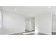 Open-concept living room with neutral walls and wood flooring at 453 Interlocken Blvd # 104, Broomfield, CO 80021