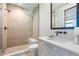 Modern bathroom features a glass enclosed shower with bench, tile accents, and sleek fixtures at 651 Emberglow Ln, Highlands Ranch, CO 80126