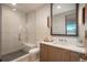Modern bathroom with glass shower, sleek vanity, and contemporary fixtures for a luxurious experience at 651 Emberglow Ln, Highlands Ranch, CO 80126