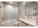 Bathroom features a shower with a glass door, tiled walls, and modern fixtures at 651 Emberglow Ln, Highlands Ranch, CO 80126