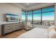 This modern bedroom boasts panoramic views, a stylish dresser, and a serene atmosphere for relaxation at 651 Emberglow Ln, Highlands Ranch, CO 80126