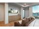 The well-appointed bedroom features a wall-mounted TV and stylish dresser, designed for relaxation and convenience at 651 Emberglow Ln, Highlands Ranch, CO 80126