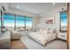 Serene bedroom with large windows, a cozy seating area, and calming decor for a peaceful atmosphere at 651 Emberglow Ln, Highlands Ranch, CO 80126