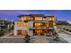 Stunning exterior view of a modern home with multi-level balconies and manicured landscaping at 651 Emberglow Ln, Highlands Ranch, CO 80126