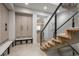 Inviting foyer with a modern staircase, built-in storage, and seamless flow to the rest of the home at 651 Emberglow Ln, Highlands Ranch, CO 80126