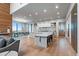 Bright, open kitchen features marble countertops, an island, and dining area with mountain views at 651 Emberglow Ln, Highlands Ranch, CO 80126