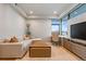 Cozy living area with sectional couch, work station, and large windows offering great natural light at 651 Emberglow Ln, Highlands Ranch, CO 80126