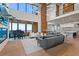 Bright open living space with modern furnishings, piano, and expansive windows at 651 Emberglow Ln, Highlands Ranch, CO 80126