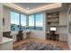 Bright home office space with built-in desks, shelving, and expansive windows offering breathtaking views at 651 Emberglow Ln, Highlands Ranch, CO 80126