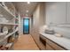 Well-organized pantry with open shelving and ample storage, near kitchen and hallway door at 651 Emberglow Ln, Highlands Ranch, CO 80126