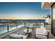 Inviting patio with comfortable seating and beautiful sunset views at 651 Emberglow Ln, Highlands Ranch, CO 80126