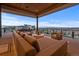 Relaxing covered outdoor space with panoramic mountain vistas at 651 Emberglow Ln, Highlands Ranch, CO 80126