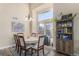 Spacious dining area with a round table and a built-in bookcase at 20572 E Girard Dr, Aurora, CO 80013