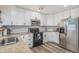 Modern kitchen with stainless steel appliances and granite countertops at 20572 E Girard Dr, Aurora, CO 80013