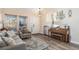 Living room with hardwood floors, piano, and ample natural light at 20572 E Girard Dr, Aurora, CO 80013