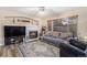 Spacious living room with a cozy fireplace and hardwood floors at 20572 E Girard Dr, Aurora, CO 80013