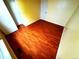 Empty bedroom featuring wood floors, neutral paint, and good natural light at 55619 E 31St Ave, Strasburg, CO 80136