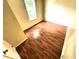 Cozy bedroom featuring wood floors, cream walls, and a bright window at 55619 E 31St Ave, Strasburg, CO 80136