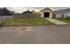 Exterior view of home featuring a concrete driveway and garage entrance at 55619 E 31St Ave, Strasburg, CO 80136