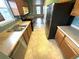 Functional kitchen featuring wood cabinets, stainless steel appliances, and neutral countertops at 55619 E 31St Ave, Strasburg, CO 80136