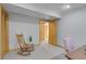 Basement rec room with cozy seating and multiple doorways that add architectural interest at 4381 S Estes St, Littleton, CO 80123
