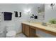 Bathroom with a long vanity with a sink and a simple mirror at 4381 S Estes St, Littleton, CO 80123