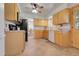 Spacious kitchen with stainless steel appliances, wood cabinets, tile floors and a door leading to the outside at 4381 S Estes St, Littleton, CO 80123