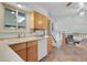 Functional kitchen featuring wood cabinetry and a skylight offering lots of natural light at 4381 S Estes St, Littleton, CO 80123