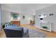 Open-concept living room with hardwood floors, neutral decor, and ample space for comfortable living at 4381 S Estes St, Littleton, CO 80123